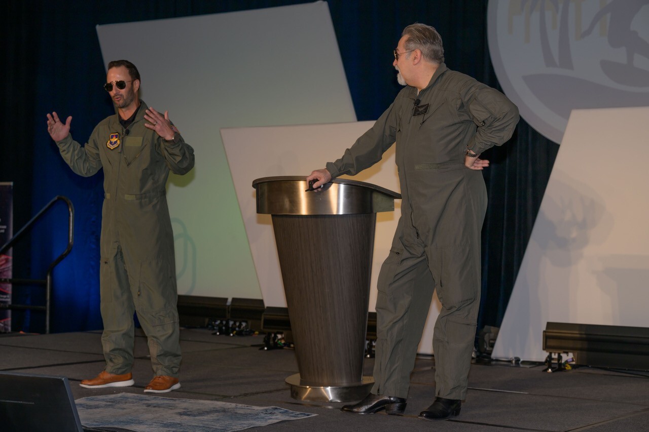 Steve Jacobs in a flight suit as MC at GCSG 2026 - once a pilot, always a pilot Steve Jacobs in a flight suit as MC at GCSG 2026 - once a pilot, always a pilot